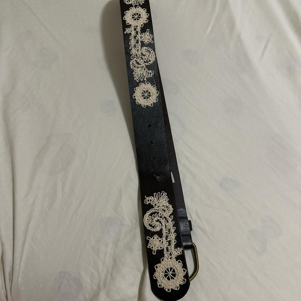 brown belt with unique cream threading with buckle